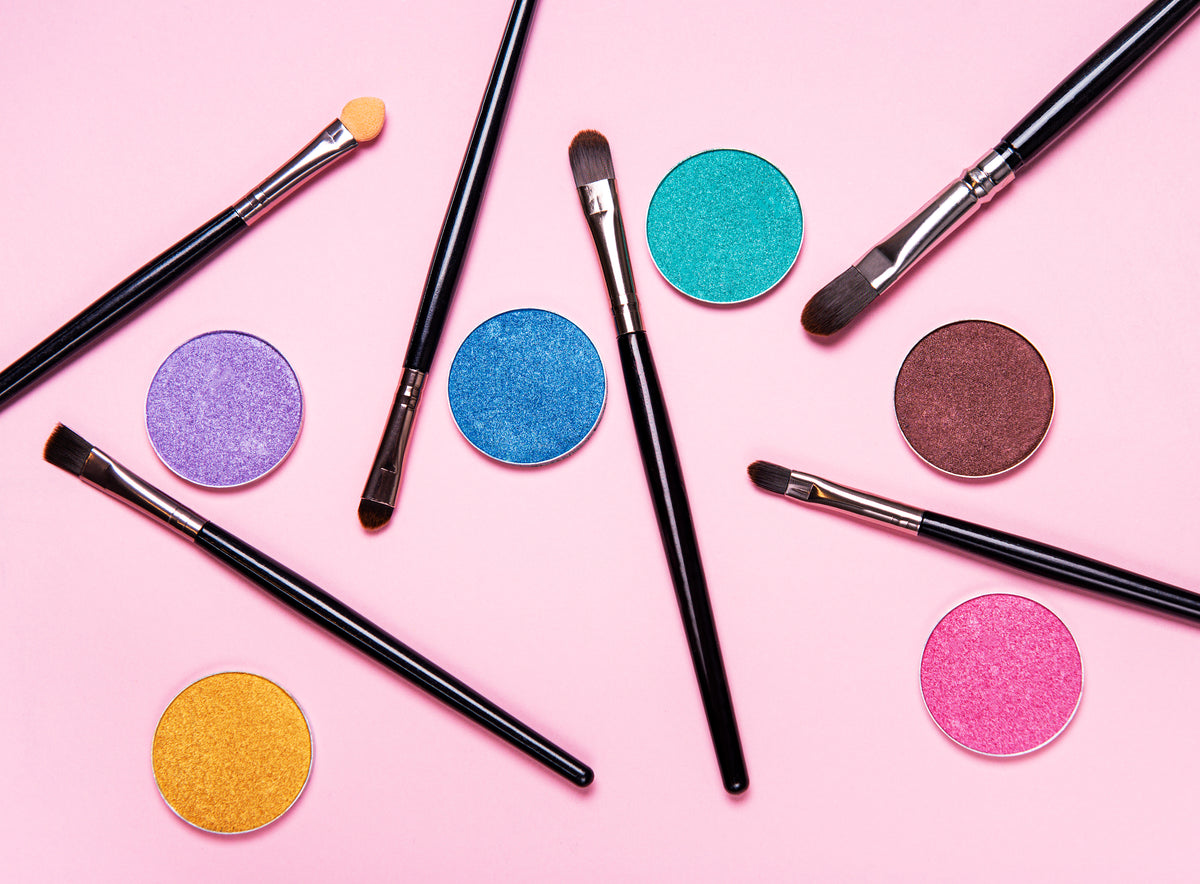 colorful-eye-shadow-and-brushes-on-pink-backdrop-2026-03-17-17-14-35-utc.jpg